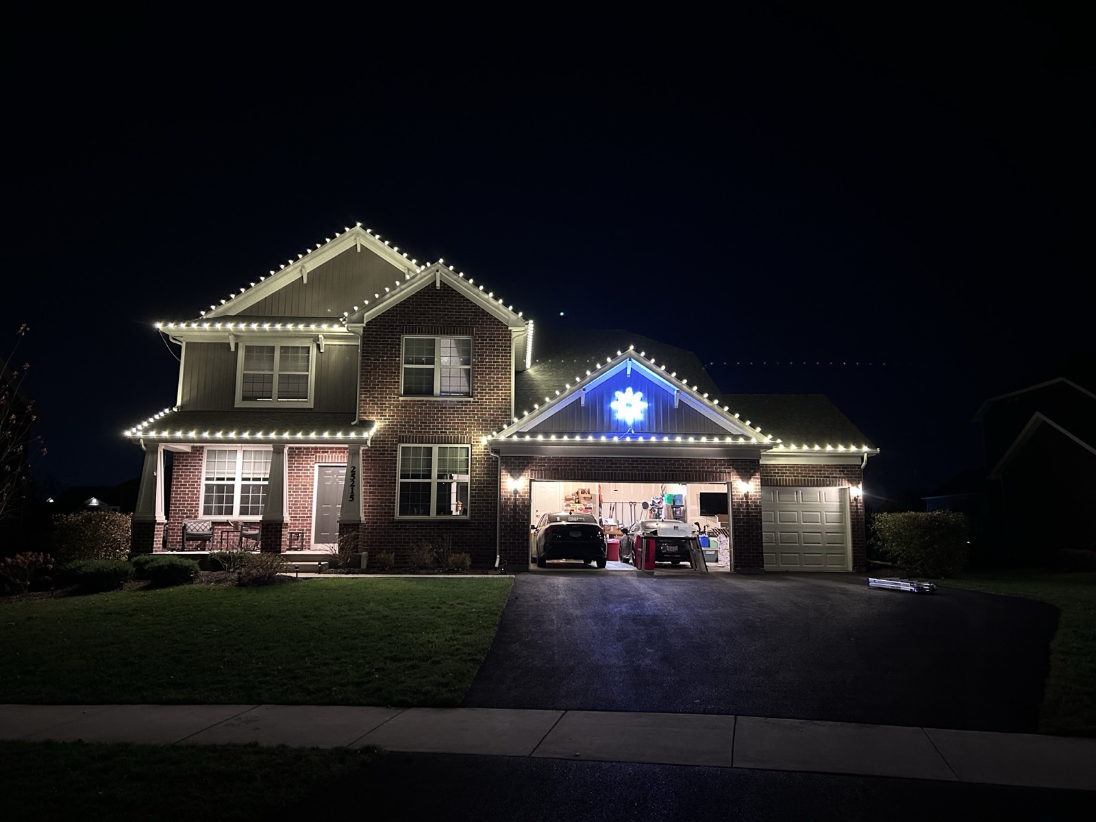 Professional Christmas light installation on a suburban home